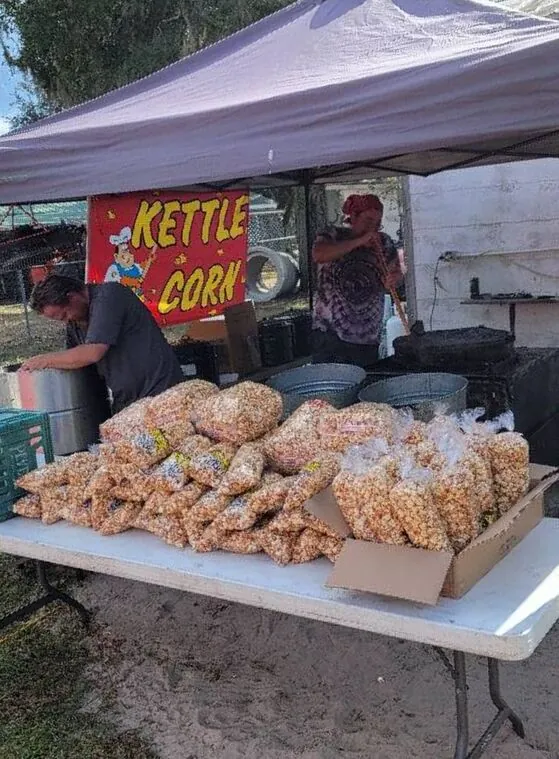 Kettle corn stand with bags of fresh kettle corn