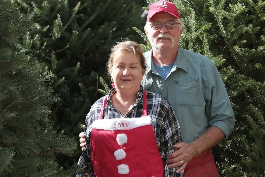 Owners Tony and Debbie Harris among the Christmas trees