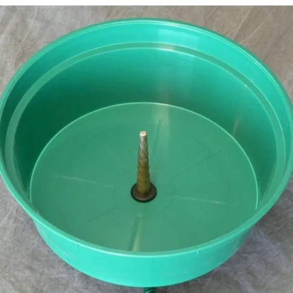 Green Christmas tree stand with a center spike